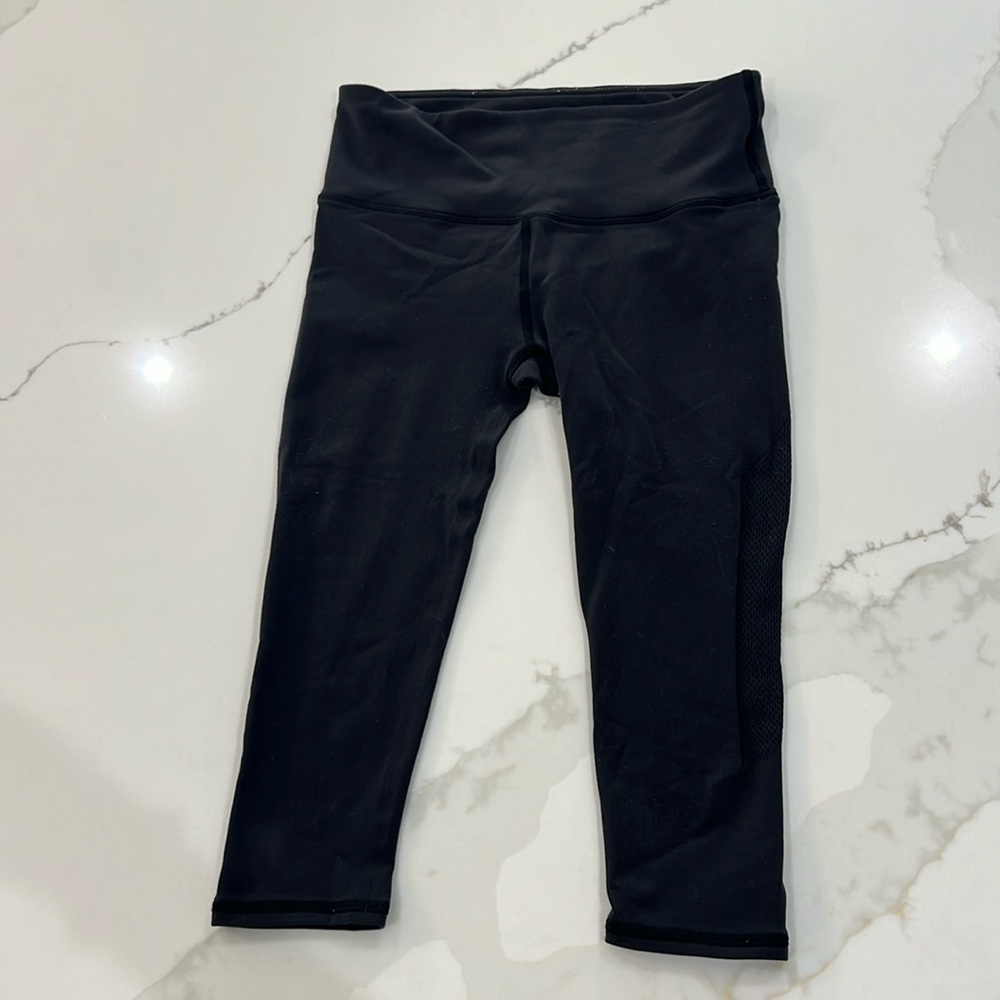 Lulu lemon black cropped leggings with cut out details on side